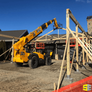 A commerical crane putting up the frame to a building