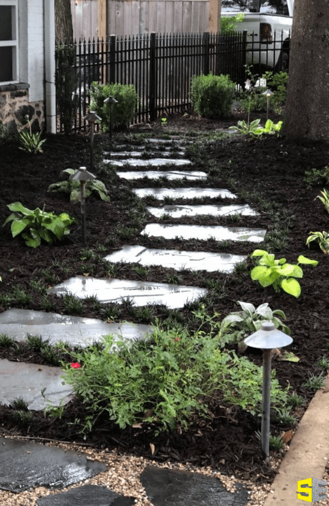 A beautiful walkway landscaped into a residential home