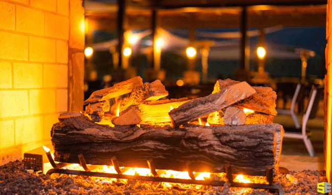 A closeup of the wood in a fireplace