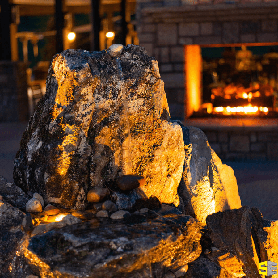 Another closeup of rock with a fireplace in the background