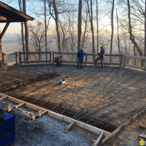 The outlines of a concrete pour with three workers in the background