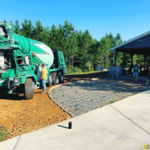 A concrete pathway in progress, a concrete truck churning the material ready to be poured