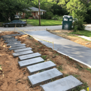 A concrete stone walkway in progress