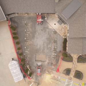 Overhead view of a construction site for a concrete drive way in progress