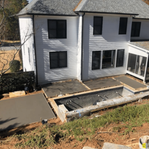 Fresh concrete poured for a backyard walkway of a residential home