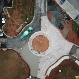 An overhead view of a roundabout having freshly poured concrete poured