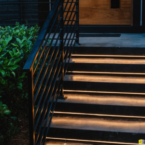 A close up of the lighting underneath concrete steps