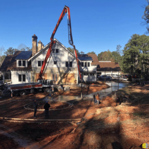 A crane, helping to pour fresh concrete into the outlines