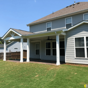 The finished product of an outdoor, covered patio, attached to a residential home