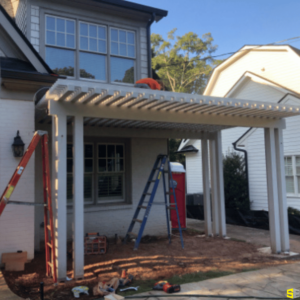 The finished frame of small trellis in a residential backyard