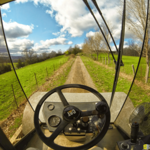 A worker driving a CAT construction vehicle