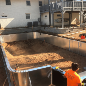 The outlines of an inground pool are made to pour concrete in