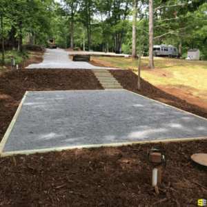 A gravel patch in a camp ground is shown