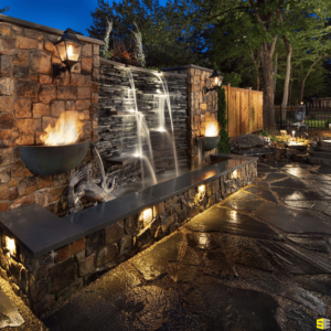 An outdoor water feature with fire like lighting