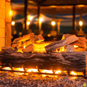 A close up of a fire lit in an outdoor fireplace